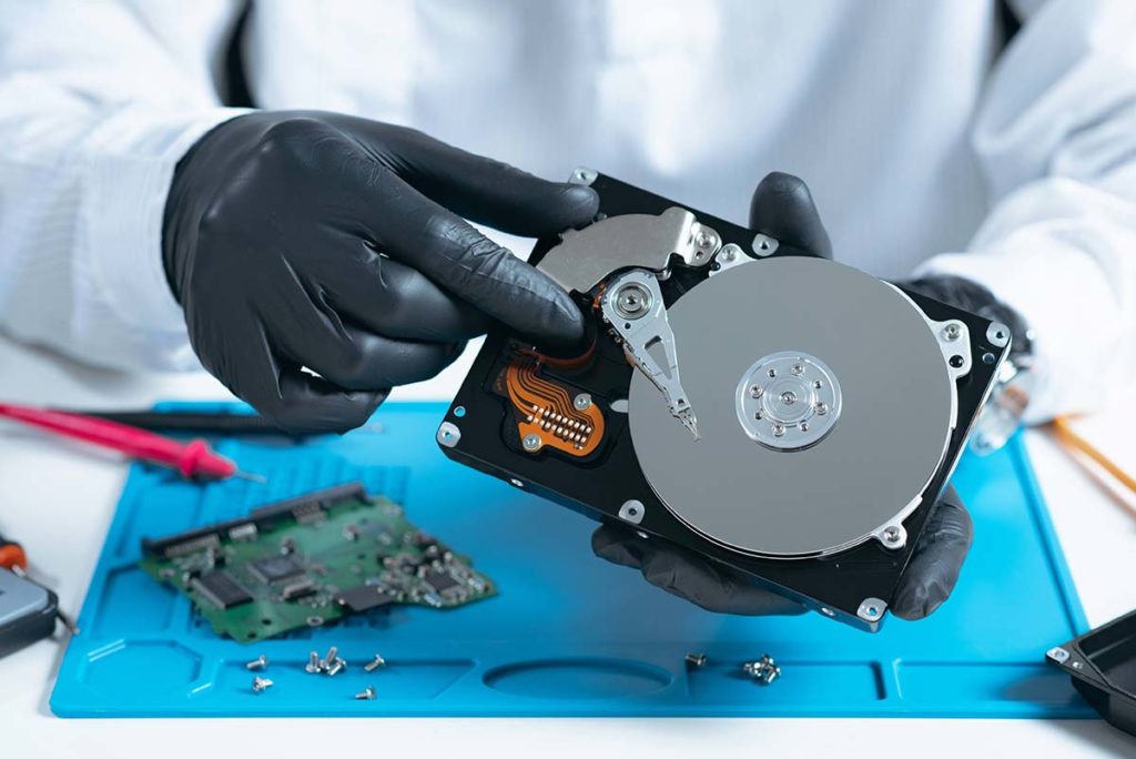 The hard drive data recovery process, being conducted by a specialist.